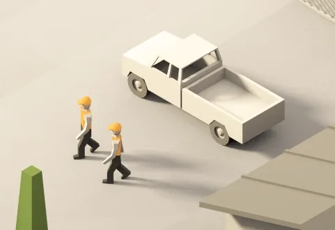 Two technicians walking to a pickup truck at a work site